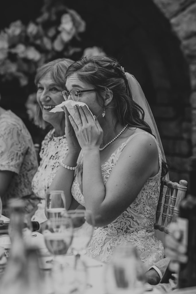 Bride wiping her tears