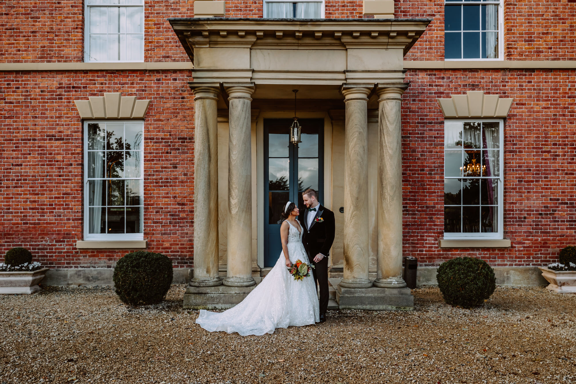 Bride and groom portrait in front of the Garthmyl Hall 