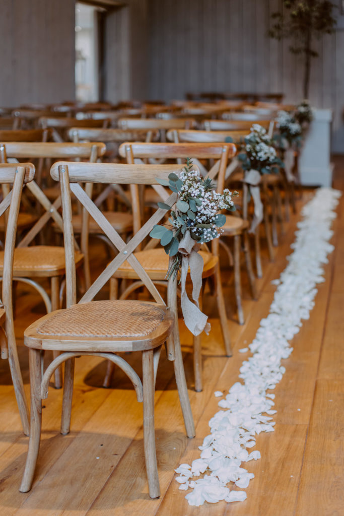 Decorated chairs in ceremony room