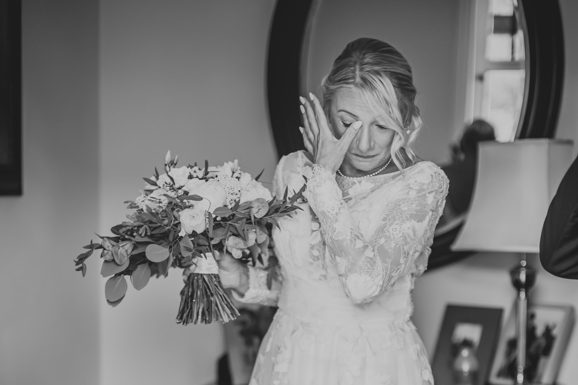 Bride having an emotional moment during bridal preparation.