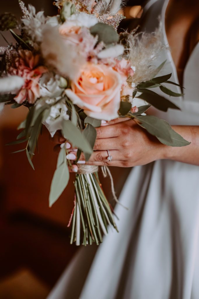 Detailed photo of bride holding her bouquet