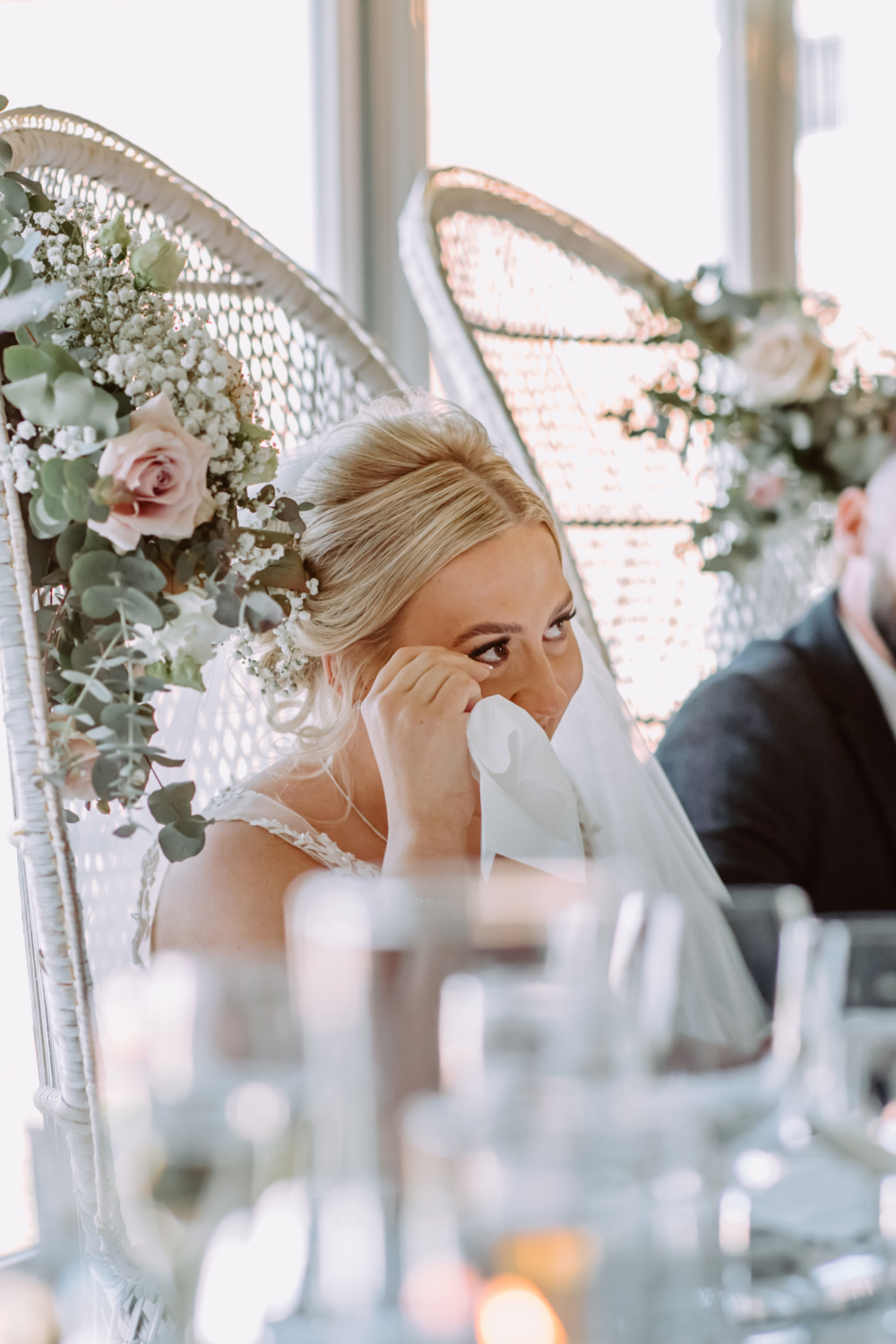 Bride wipes her tears during the speech 