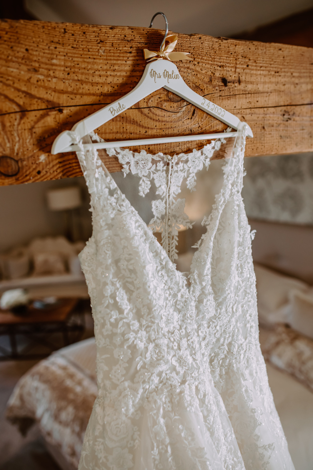 Detailed photo of hanger with bride's dress 