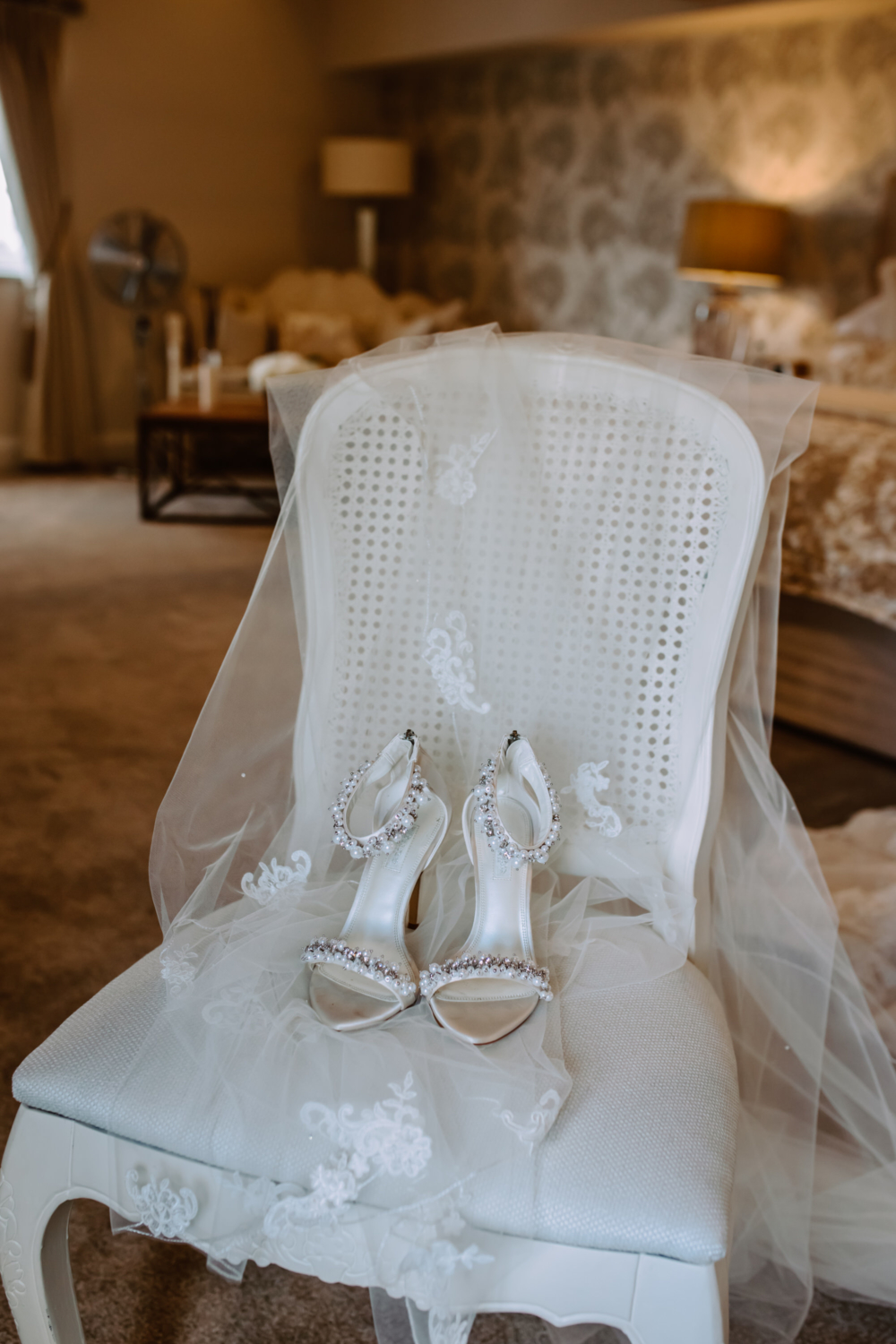 Shoes placed on chair with the veil