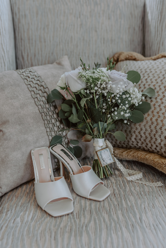 Detail photo of bridal shoes and bouquet 