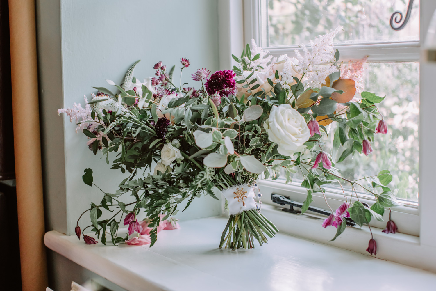 Bridal bouquet placed by the window