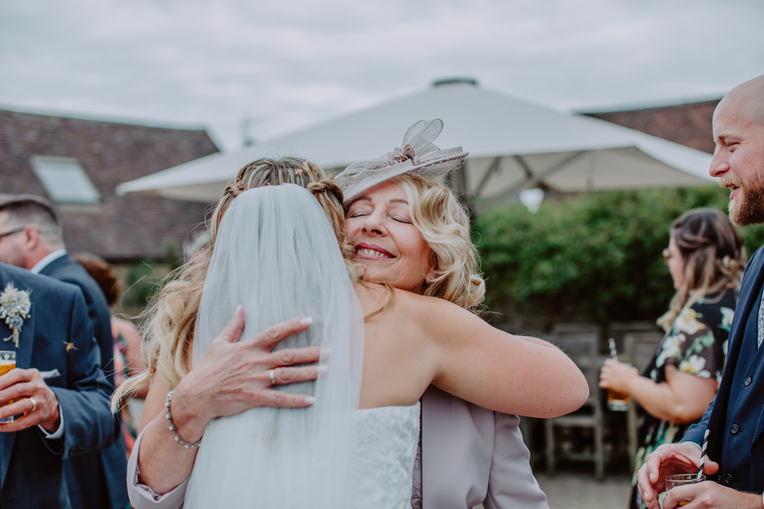 Bride and her mum hugs
