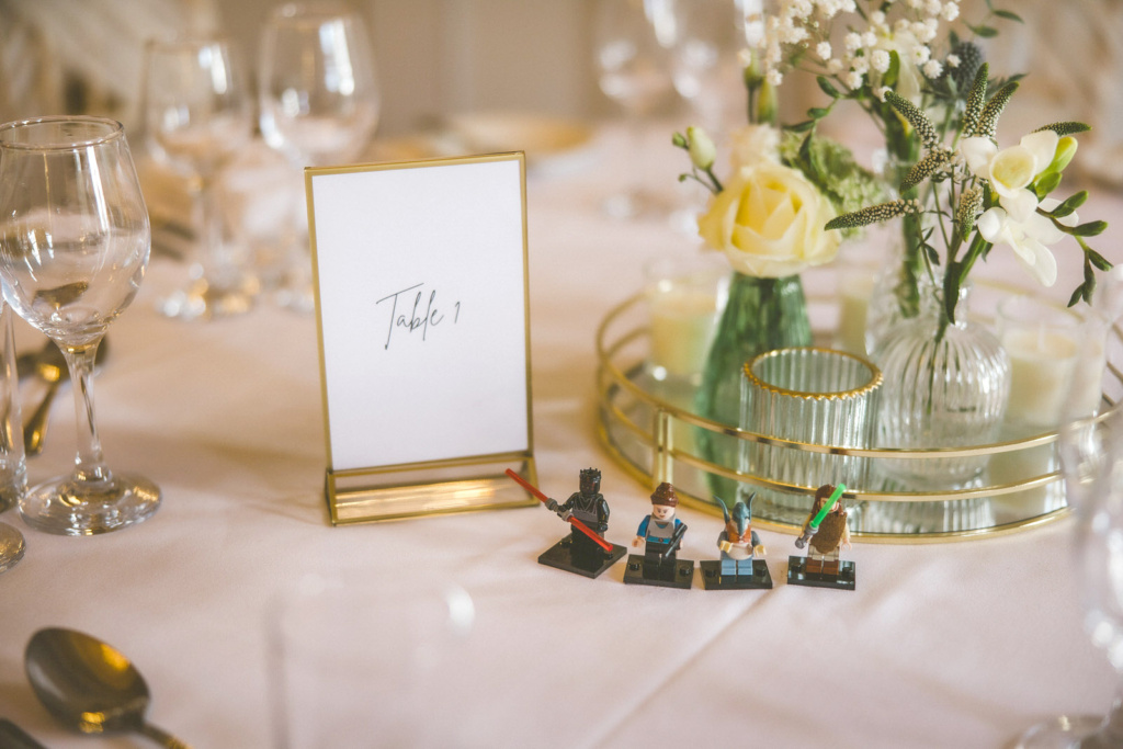 A table with a table number and figurines.