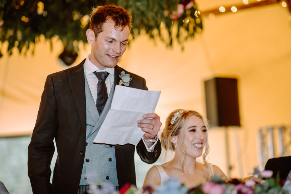 The groom reading his speech during the wedding breakfast in the Tipi.