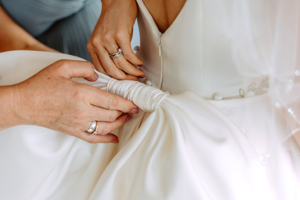 A person tying a dress.