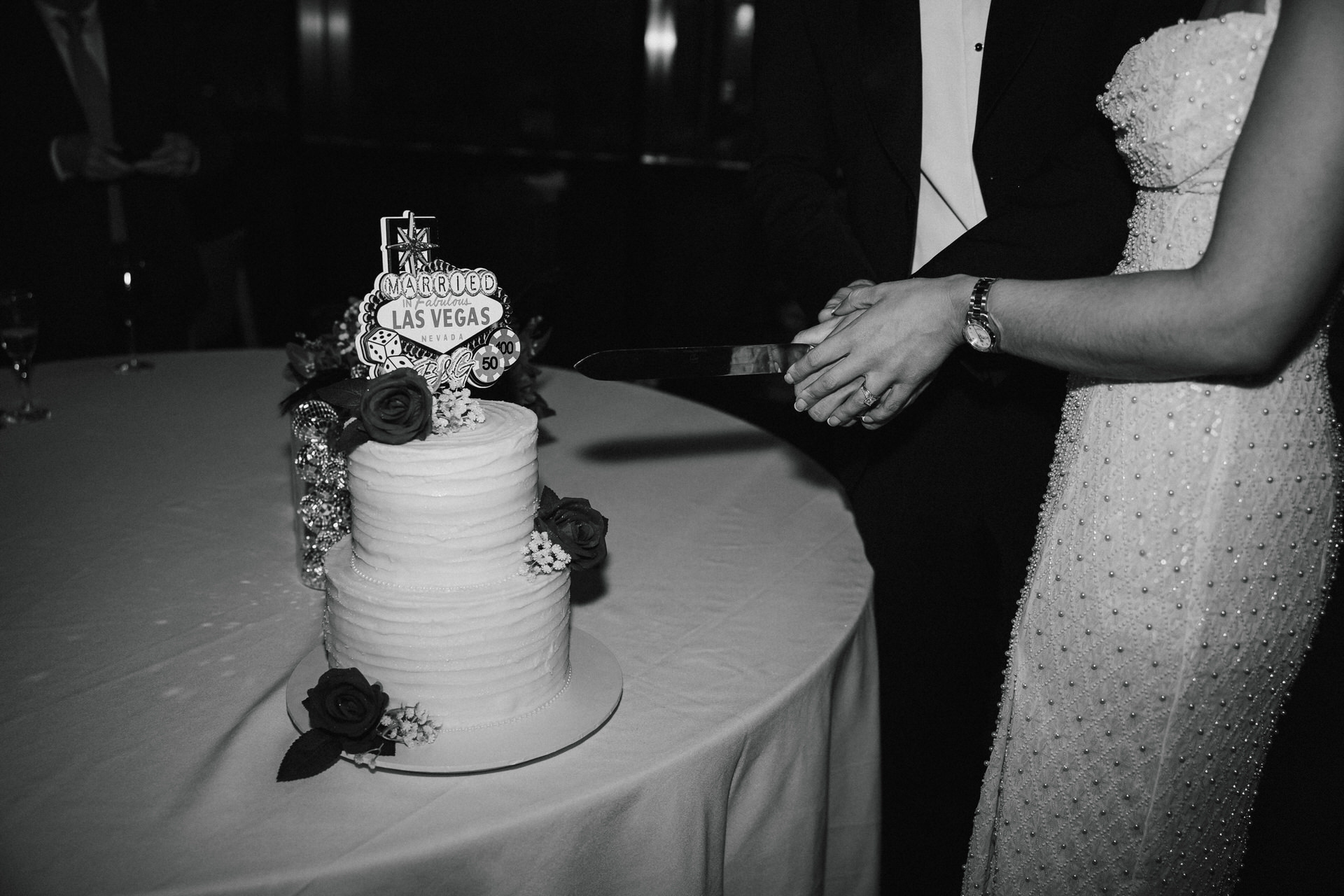 Birmingham Wedding Photographer Digbeth 65 A bride in a white dress and a groom in a tan suit walk down a staircase in The Grand Hotel Birmingham, holding hands and smiling, beautifully captured by their wedding photographer.